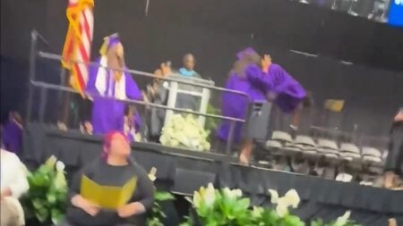 High school student graduation backflip