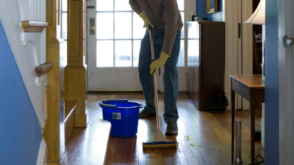 Housekeeper mopping a floor
