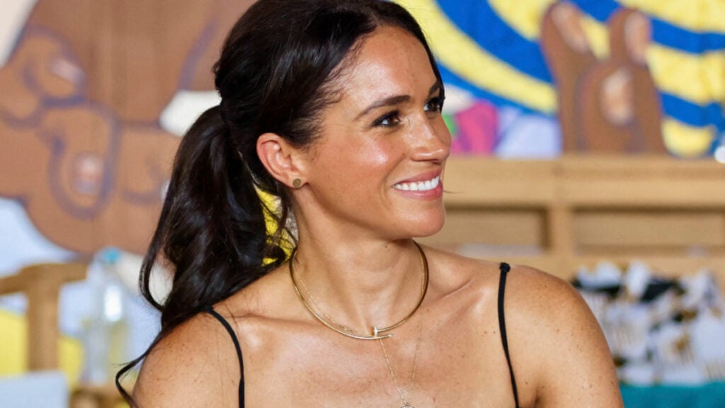 Meghan Markle in a striped dress during tour of Colombia.