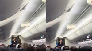 Delta flight attendant speaking to passengers