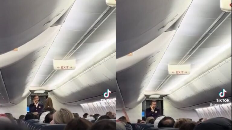 Delta flight attendant speaking to passengers